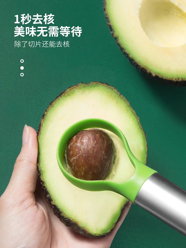 Green and stainless steel avocado pit remover and slicer tool