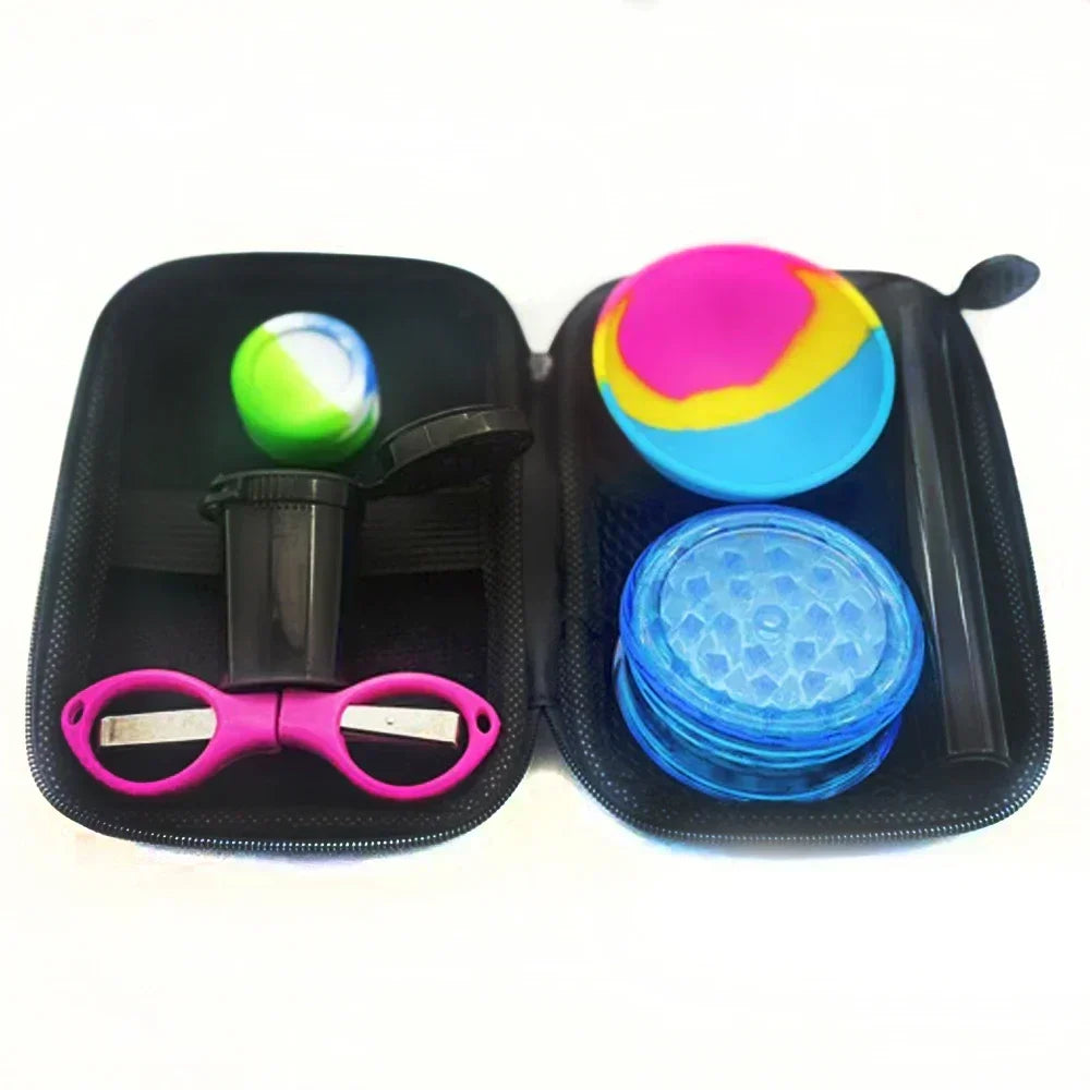 A black zippered carrying case containing a blue plastic grinder, pink scissors, a small container, and a multi-colored