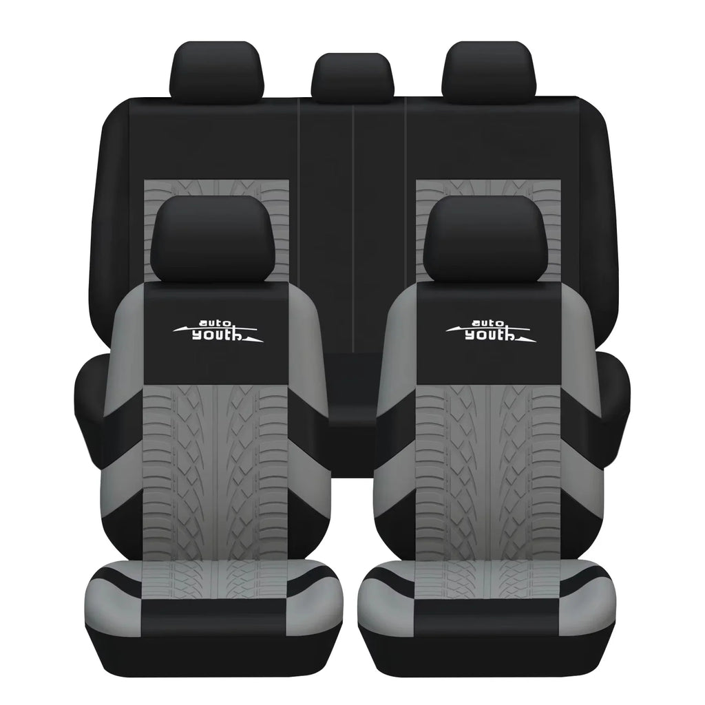 Grey and black car seat covers with tire track embroidery