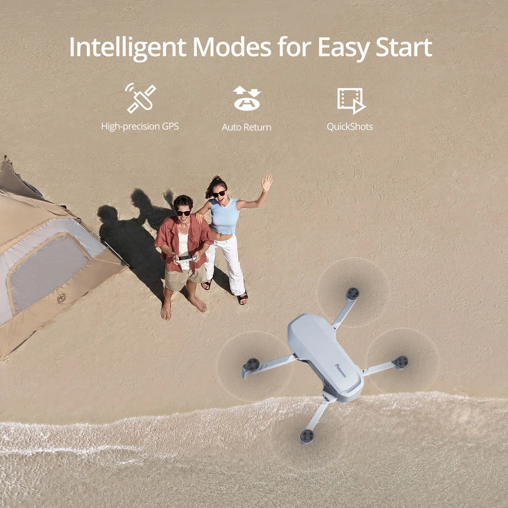 Aerial view of a couple on a beach with a drone hovering above them