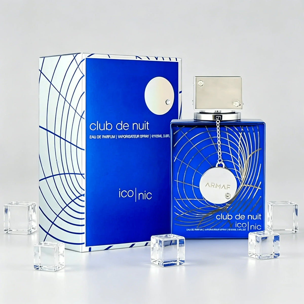 Blue perfume bottle and box styled with decorative clear glass ice cubes.