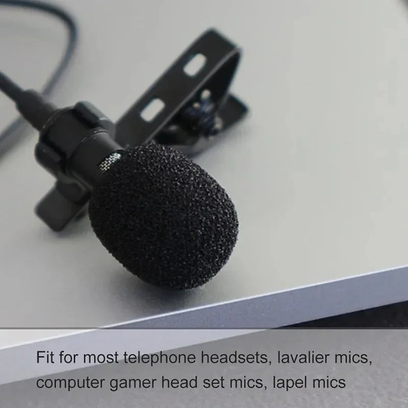 Black foam windscreen cover on a clip-on lavalier microphone