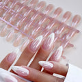 French tip almond-shaped press-on nails with a pearlescent finish on a tray
