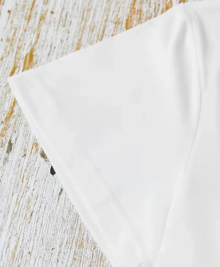 Close up of the sleeve hem detail on a white short sleeve t-shirt