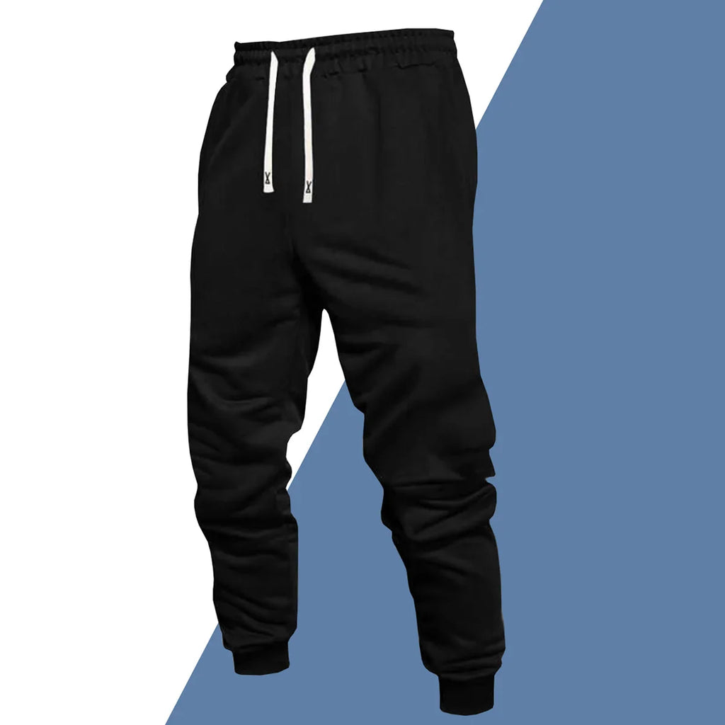 A pair of black casual sweatpants with an elastic waistband and white drawstring.