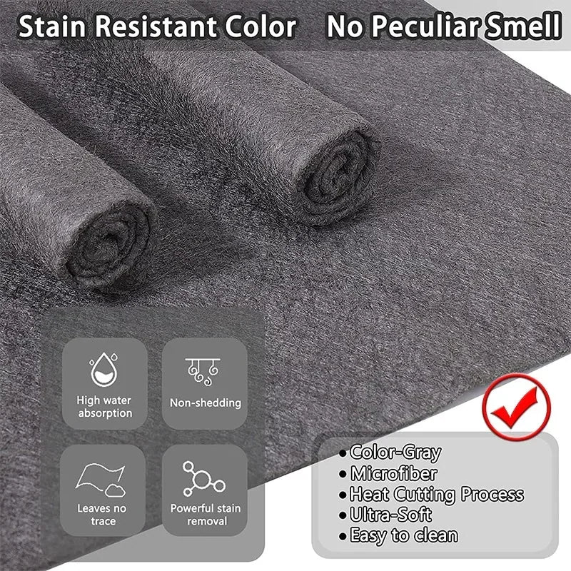 Grey microfiber cleaning cloths with labels describing features like high absorption and stain resistance.