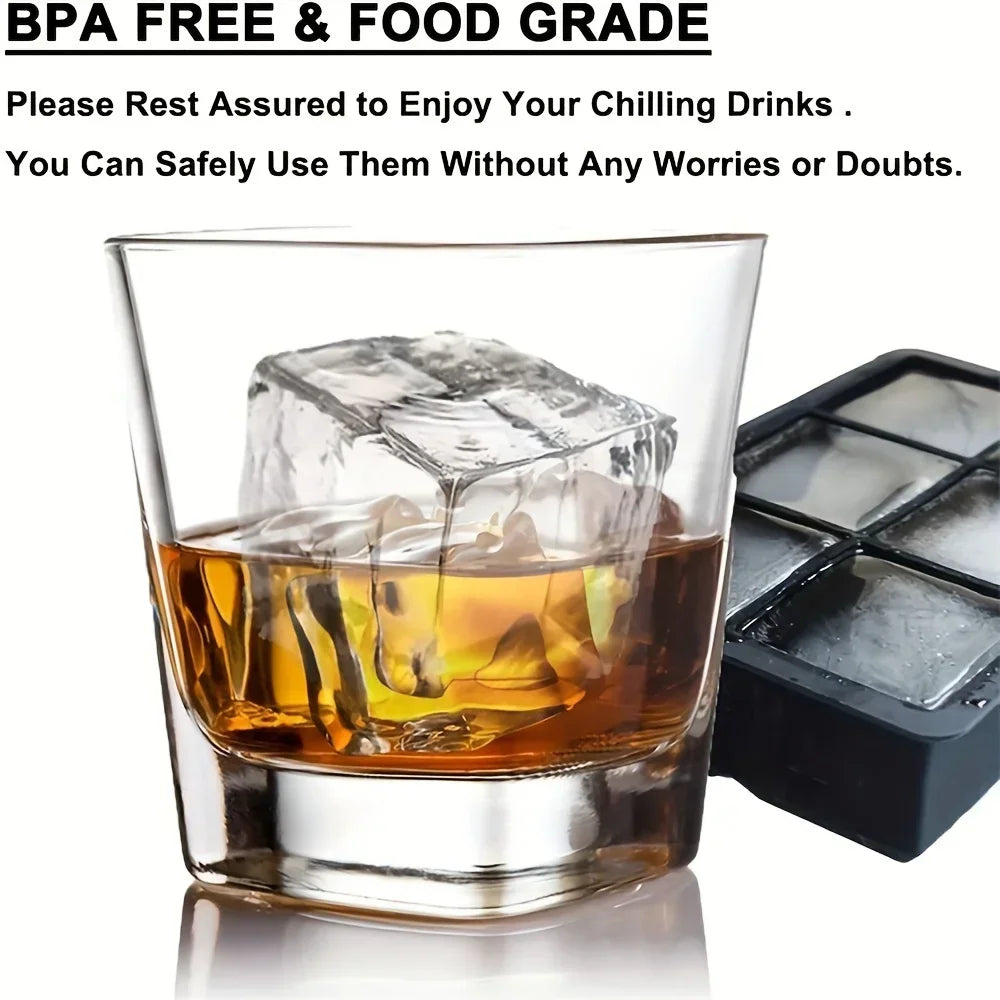 Glass of whiskey with an ice cube and a silicone ice cube mold tray