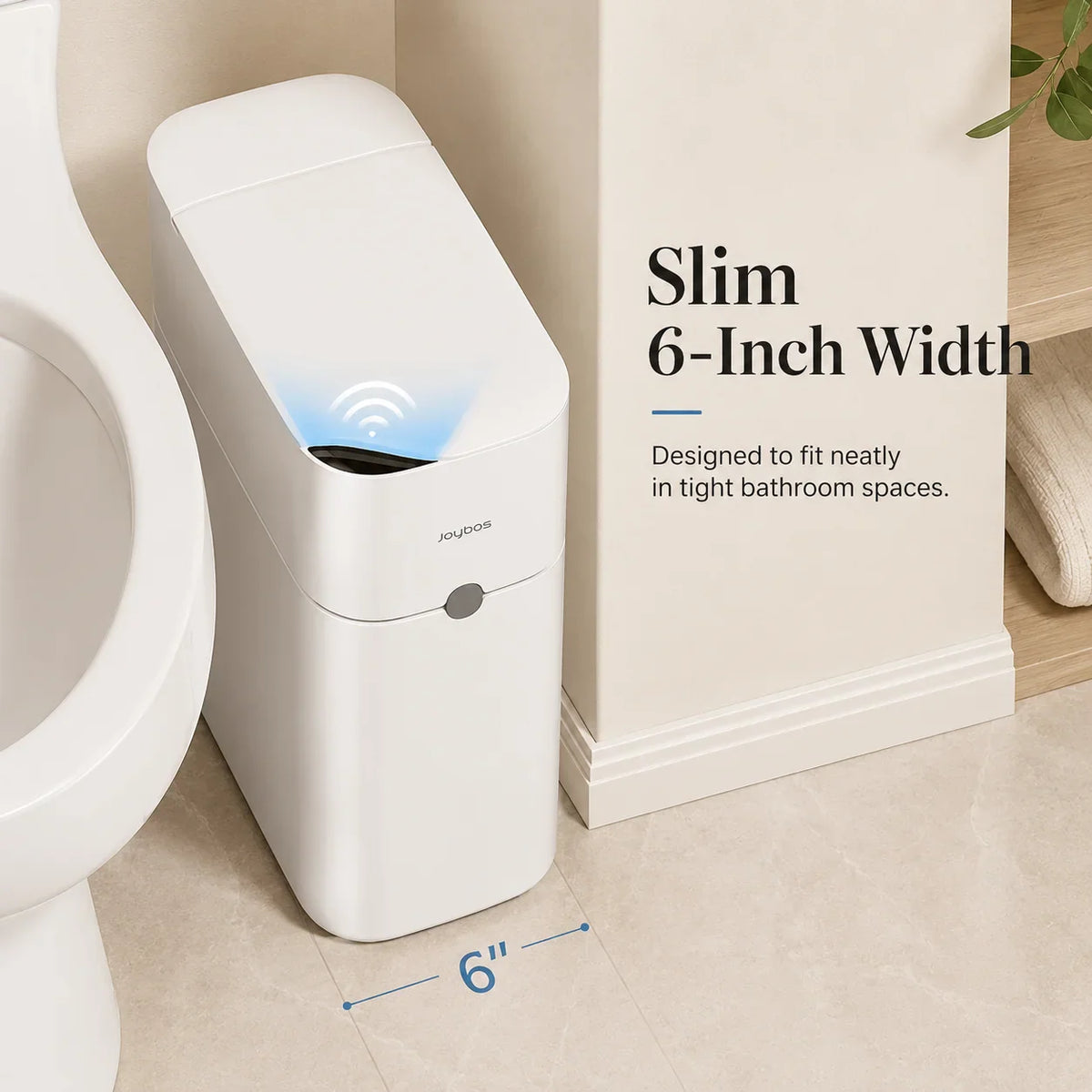 Slim white touchless bathroom trash can showing its 6-inch narrow profile next to a toilet