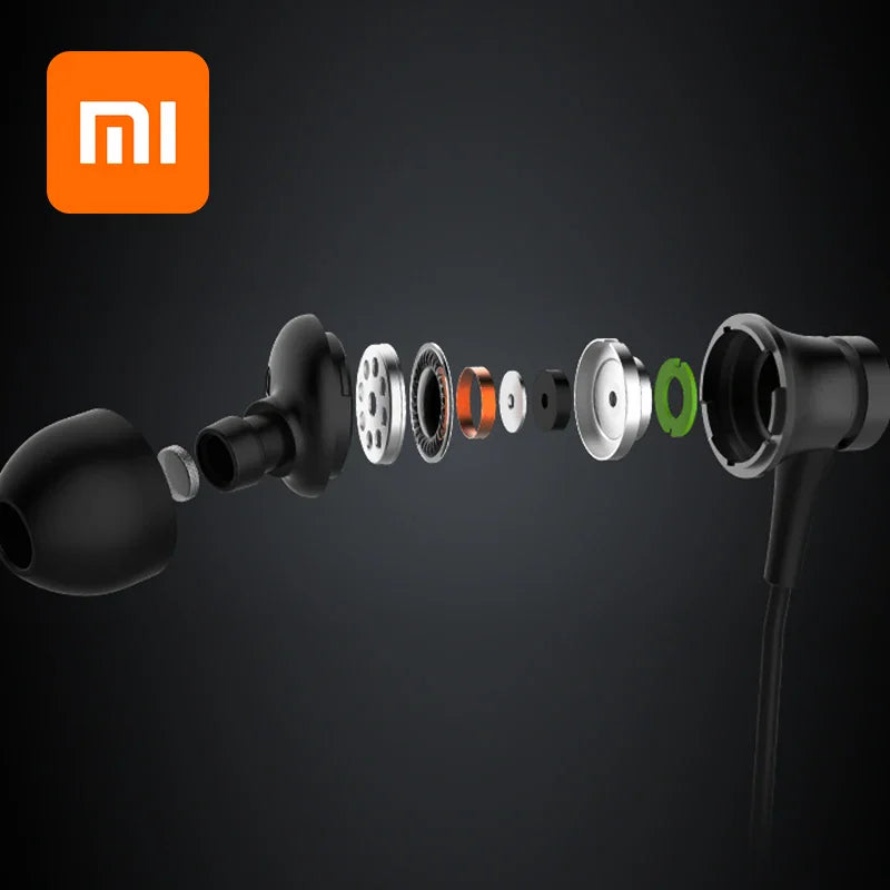 Exploded view showing the internal components of a black in-ear earphone