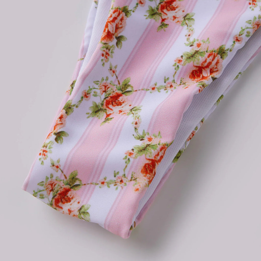 High-waisted bikini bottom with pink stripes and floral print