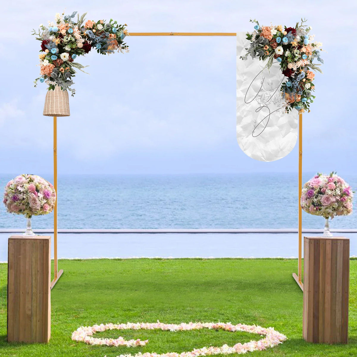 Golden metal square arch stand decorated with flowers for a wedding ceremony on a beach