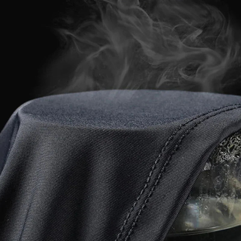 Close up of black fabric with steam rising from it to demonstrate cooling effect