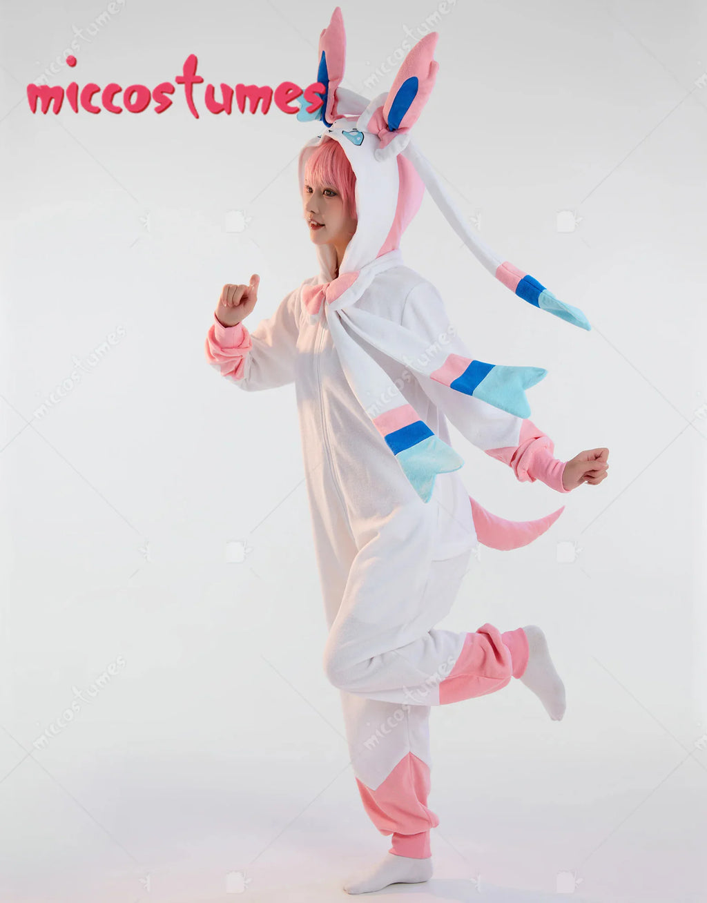 Side view of a person wearing a white and pink hooded anime onesie