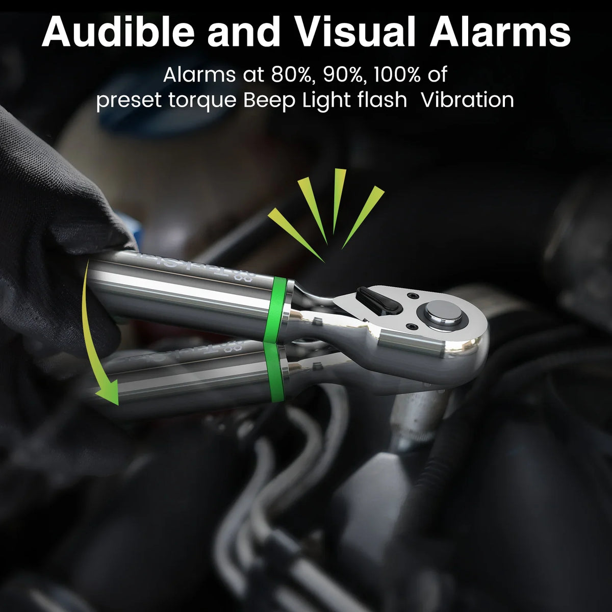 Close up of a digital torque wrench displaying audible and visual alarm features