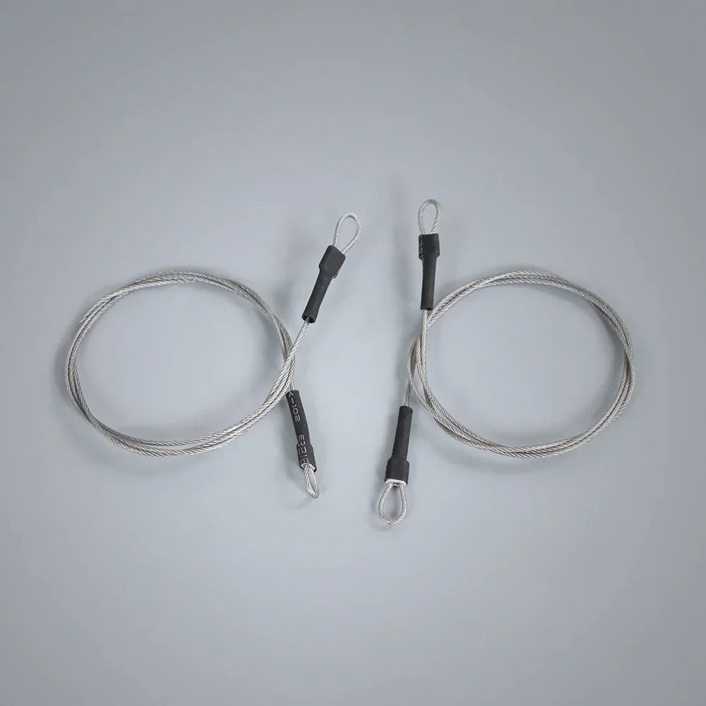 Two 50cm adjustable steel rope limb risers with black heat shrink tubing on a grey background