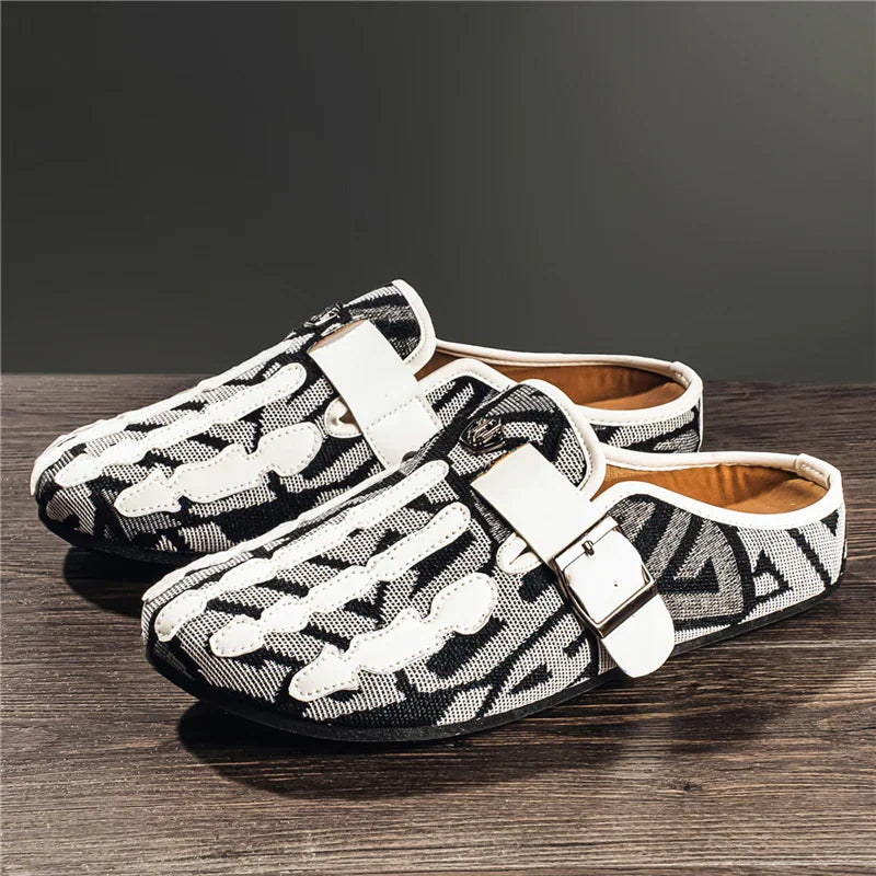 Men's slip-on mule shoes with a black and white geometric pattern and white skeleton hand design, white buckle strap