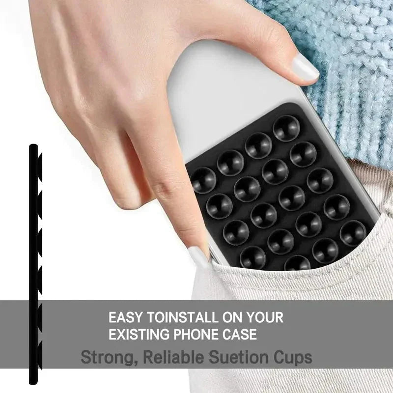 Silicone suction cup mount attached to the back of a smartphone being placed into a pocket