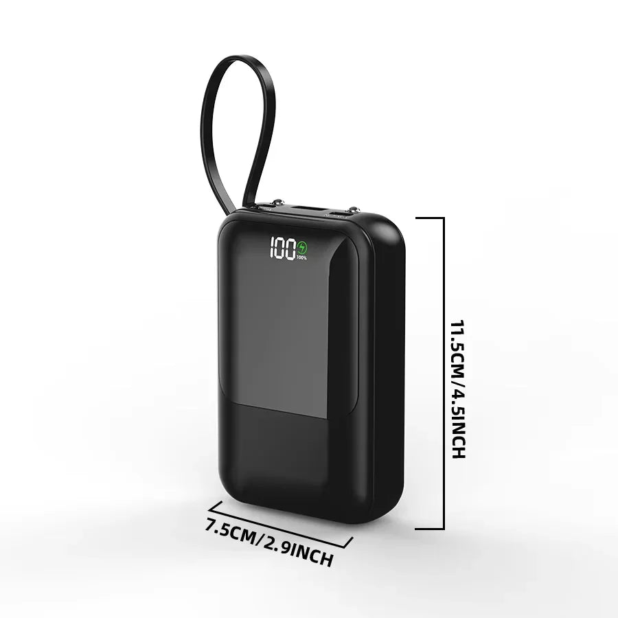 Black portable power bank with measurement lines indicating dimensions in centimeters and inches.