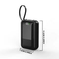 Black portable power bank with measurement lines indicating dimensions in centimeters and inches.
