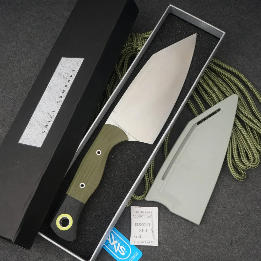 A stainless steel chef knife with an olive green and black micarta handle, displayed in its box with a sheath.
