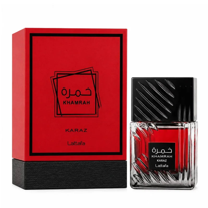 A bottle of unisex eau de parfum next to its red and black presentation box