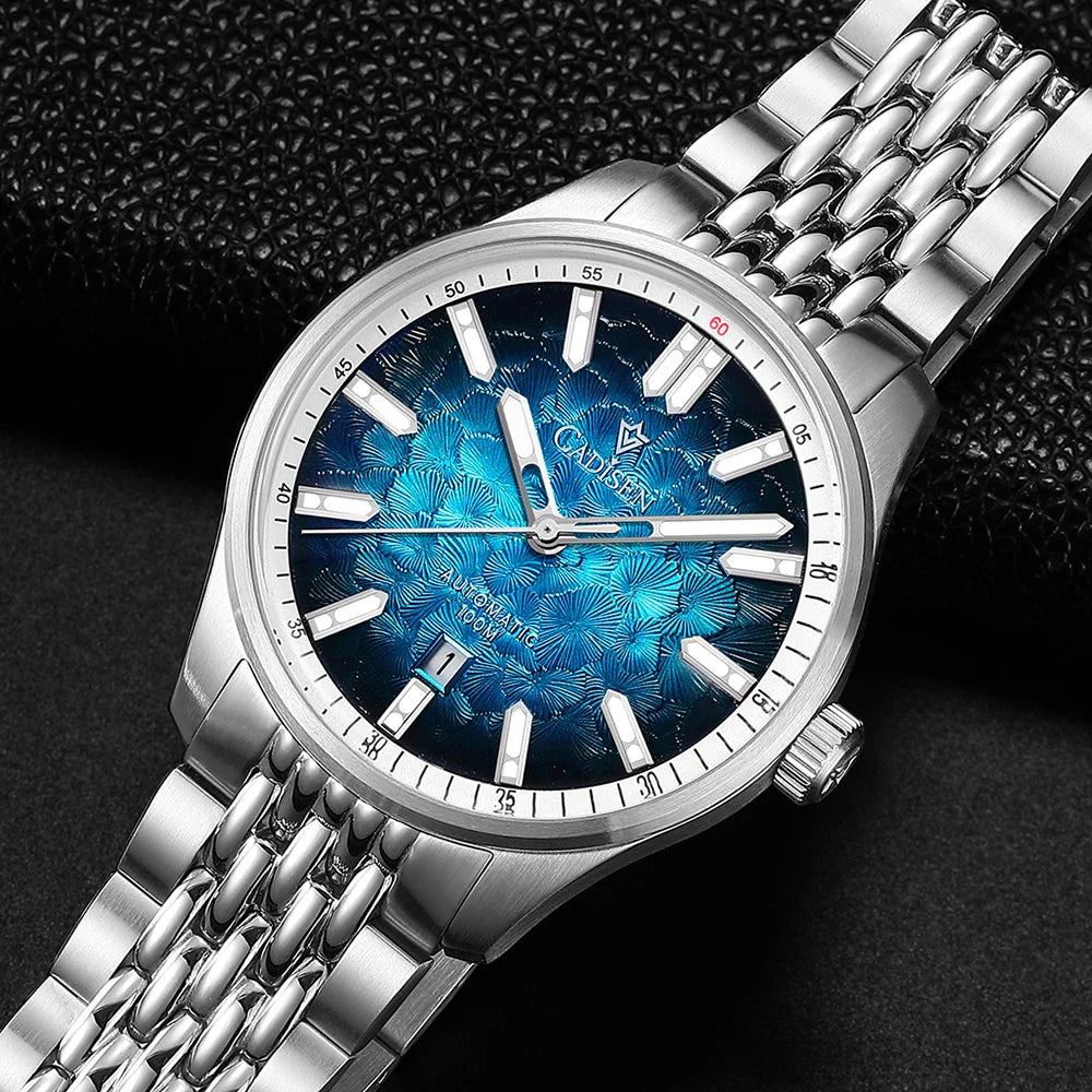 Close-up of a silver automatic men's wristwatch with a blue patterned dial.