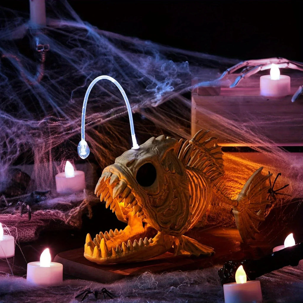 Skeleton fish Halloween decoration in a spooky setup with candles and cobwebs