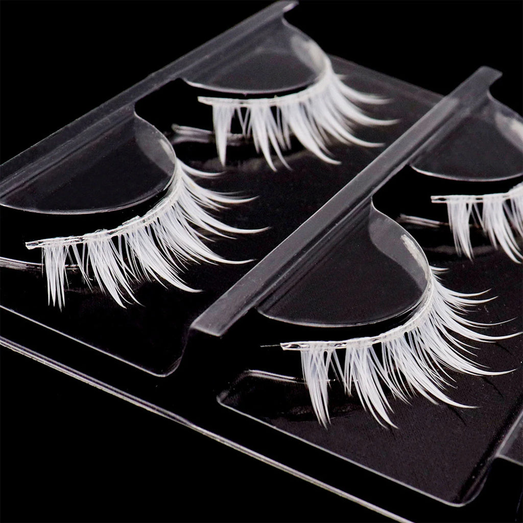 Three pairs of white cluster false eyelashes in a plastic tray