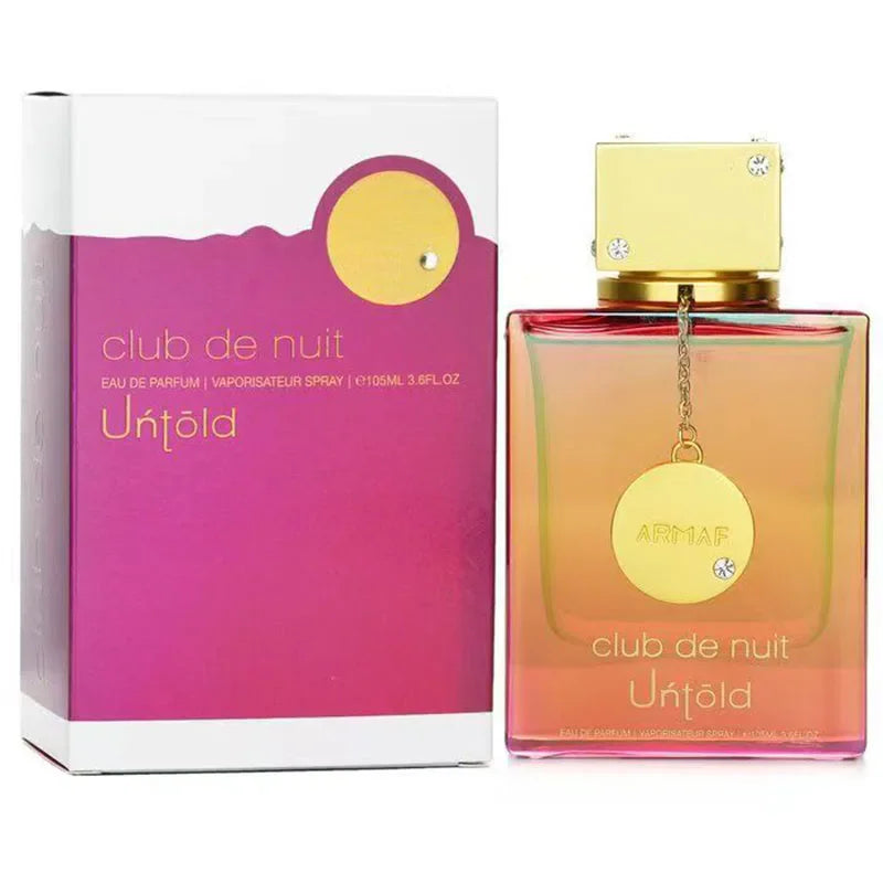 Purple and orange perfume bottle and its matching box on a white background