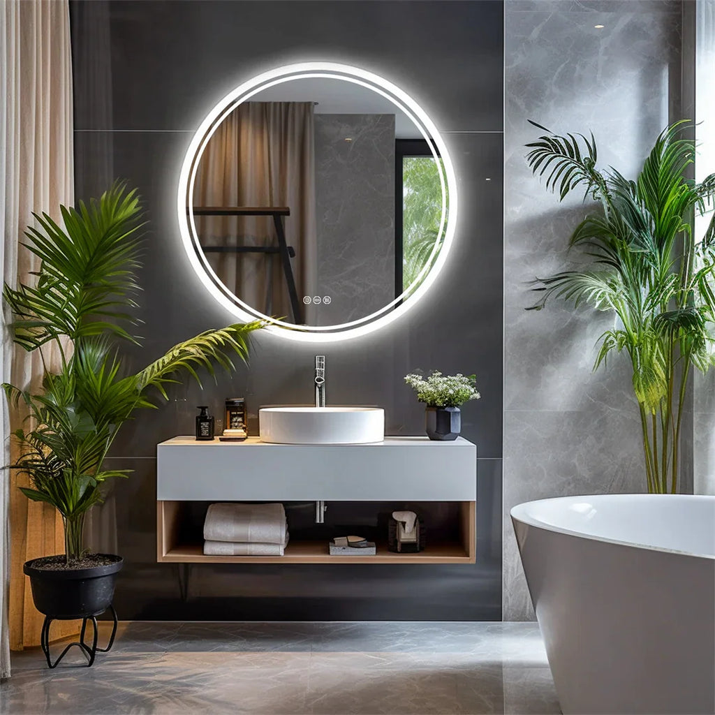 Round wall mirror with backlit LED frame mounted above a bathroom sink