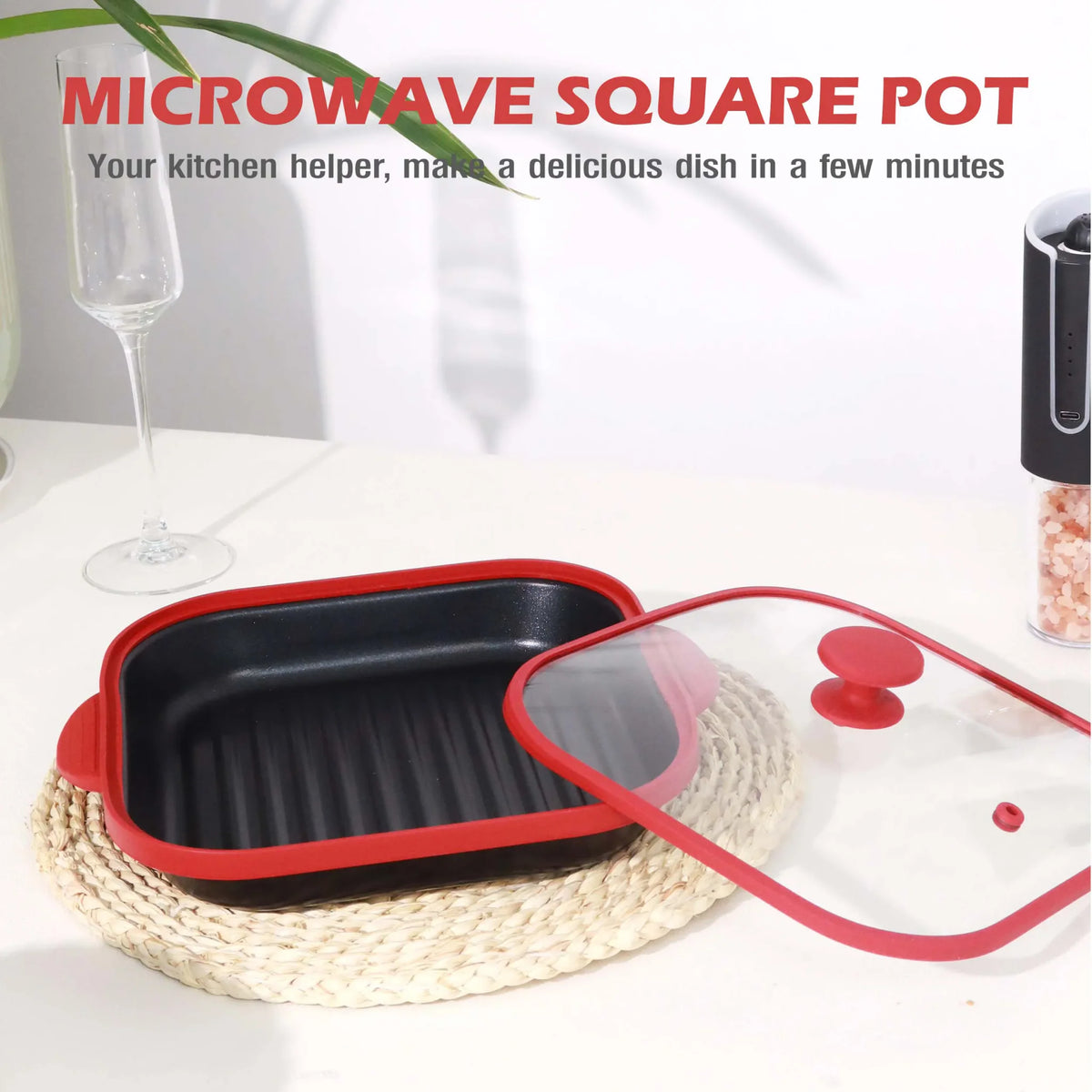 Red square microwave pot on a table with a glass lid