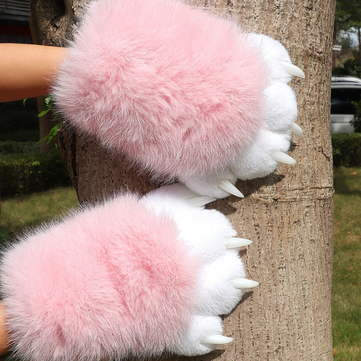 Pair of pink and white plush furry animal paw gloves with claws