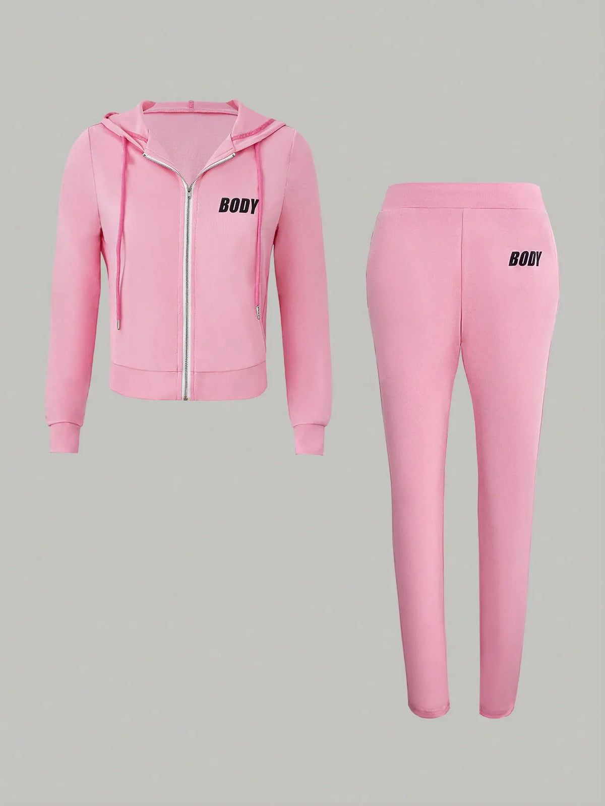 A pink two-piece set featuring a zippered hooded sweatshirt and matching sweatpants with printed black text.