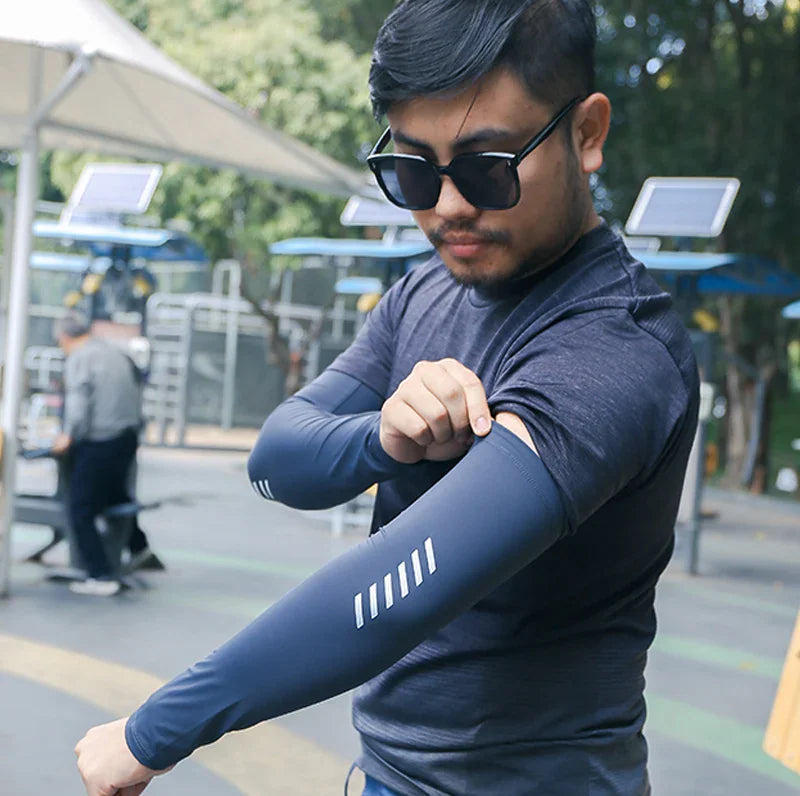 Man wearing blue arm sleeve during outdoor exercise
