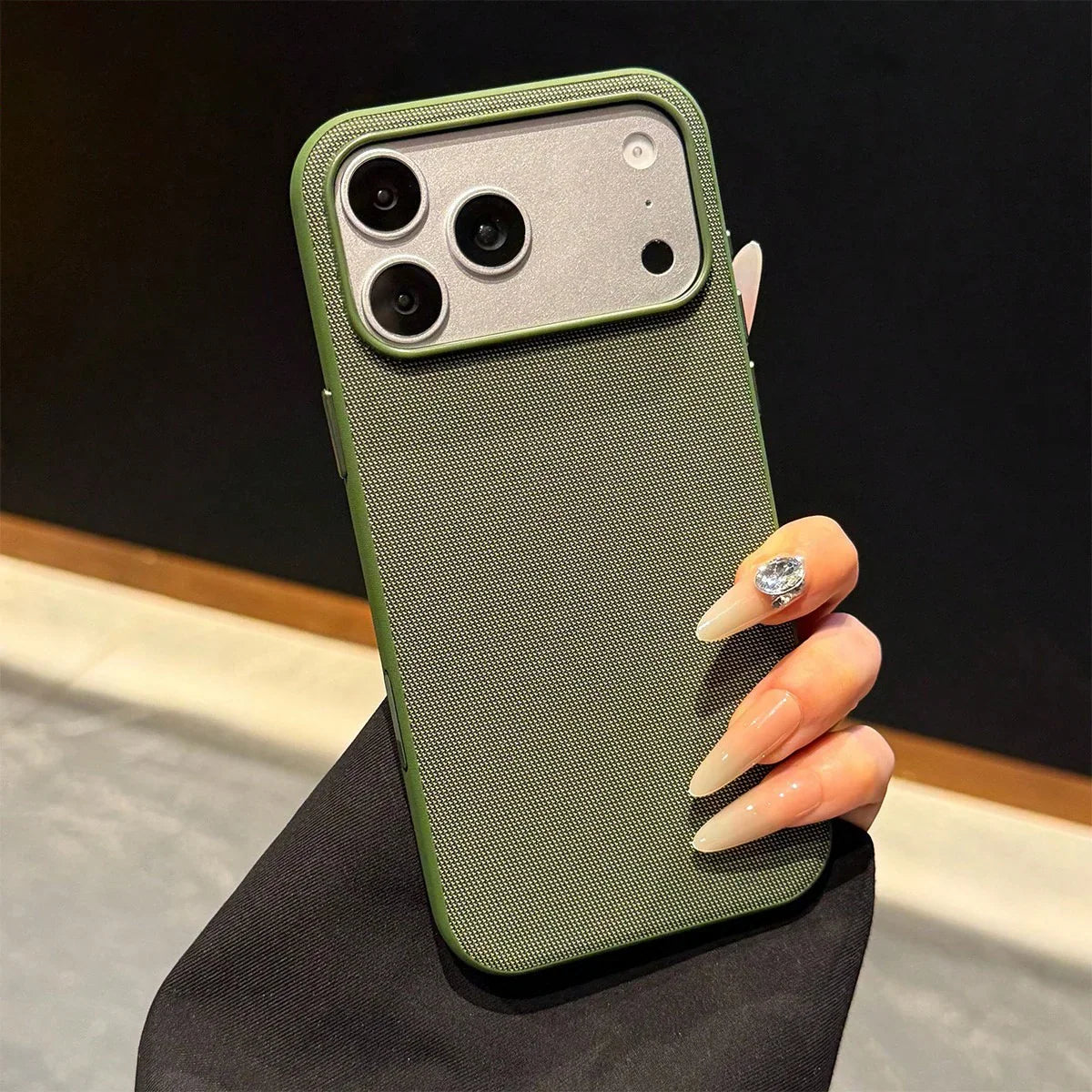 Green woven fabric protective phone case with camera lens cutouts