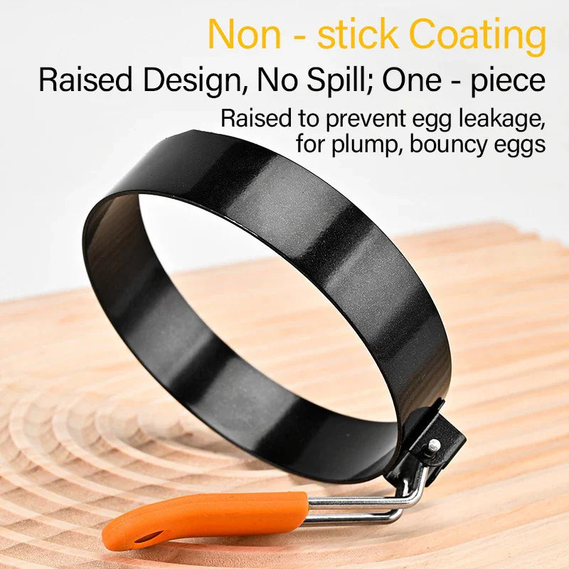 Single round black egg ring mold with an orange silicone handle