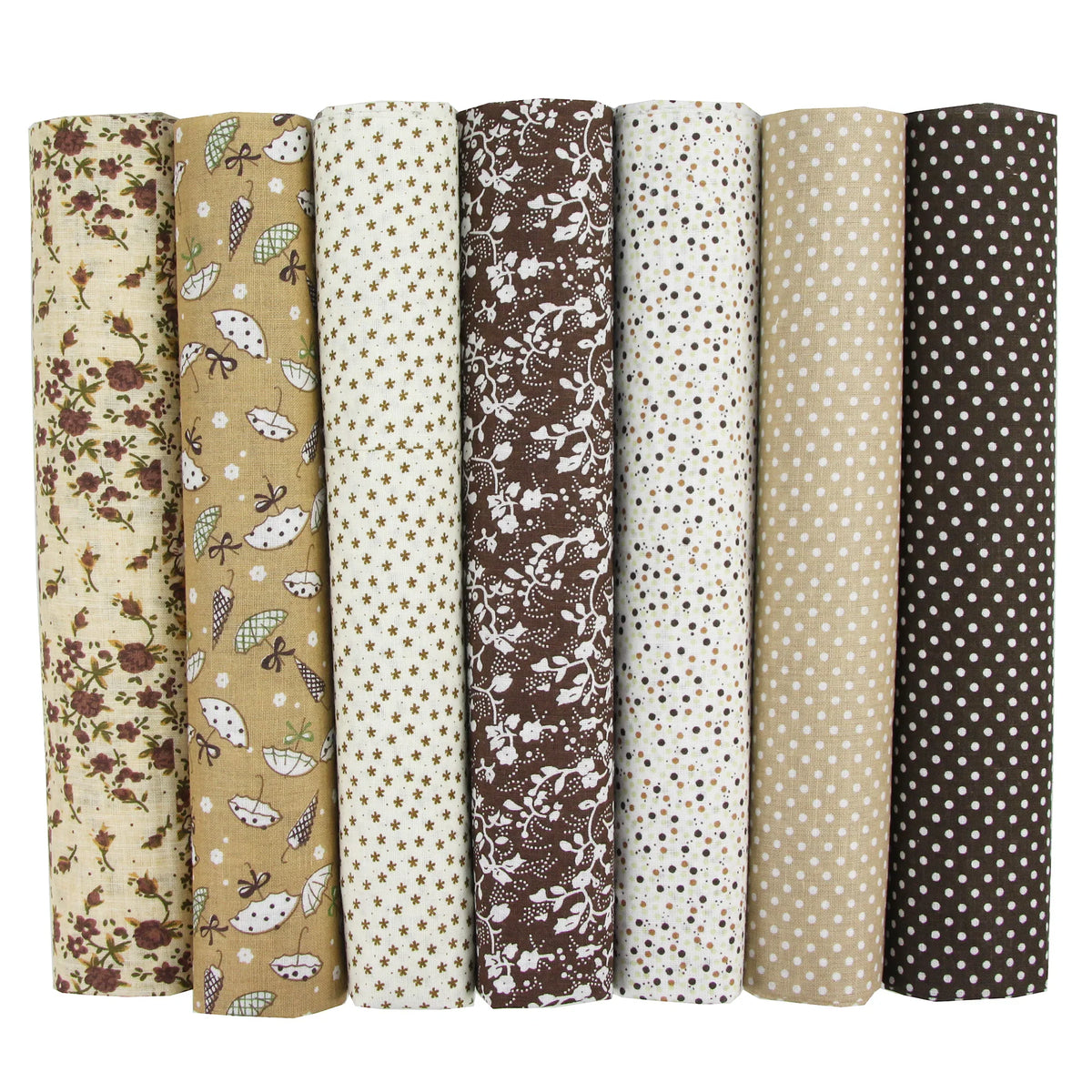 Seven rolls of earth-toned fabric with various patterns including flowers, umbrellas, stars, and dots.