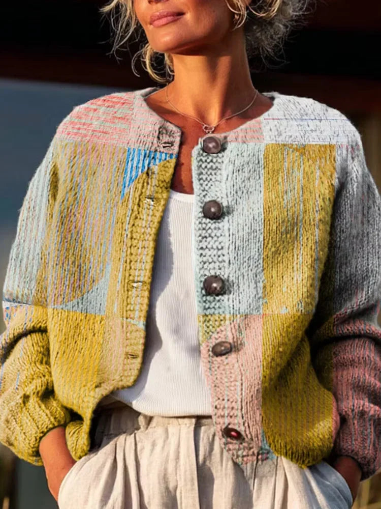 Woman wearing a button-front multi-colored patchwork knit cardigan sweater