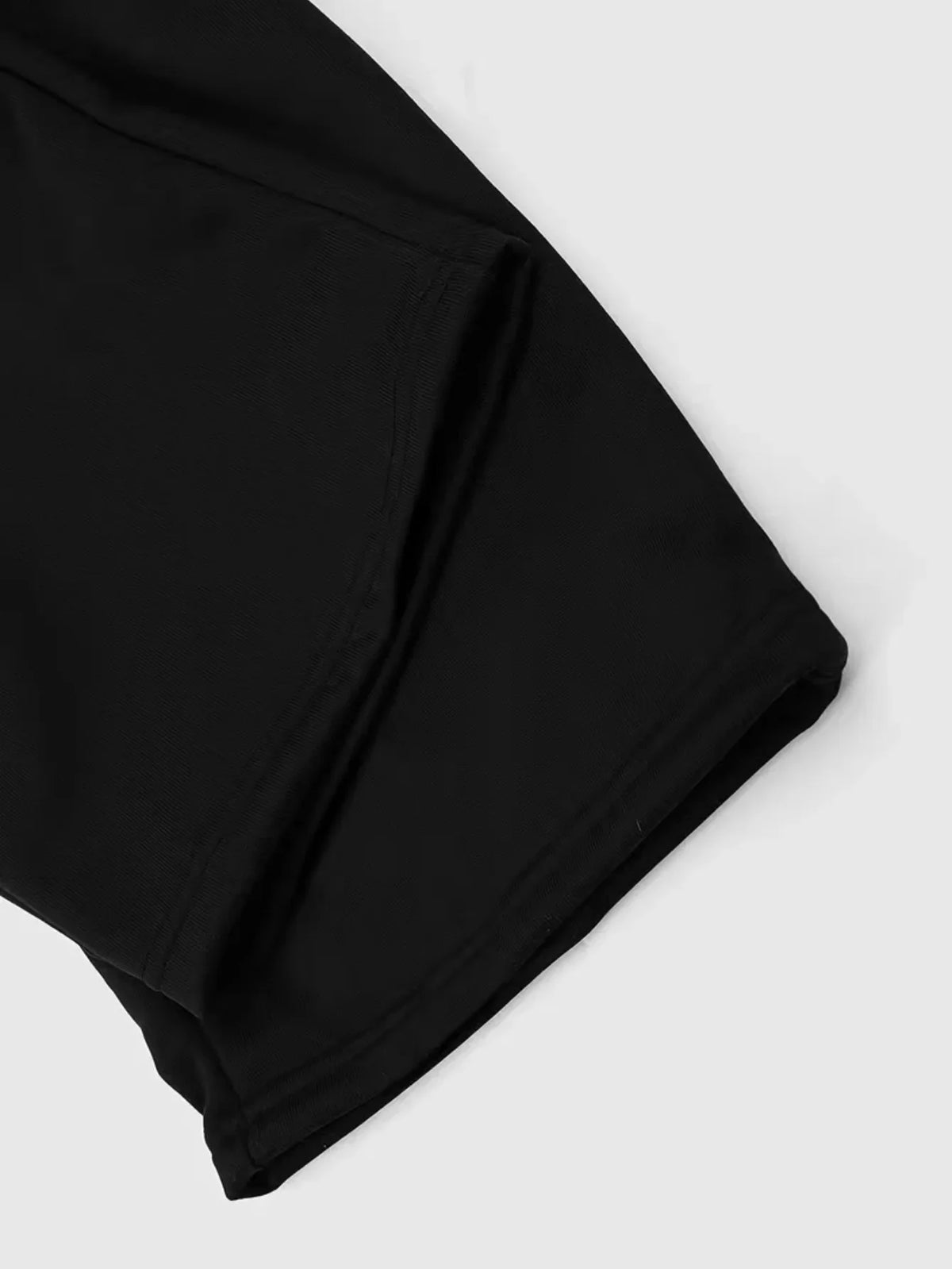 Close-up of black sweatpants hem