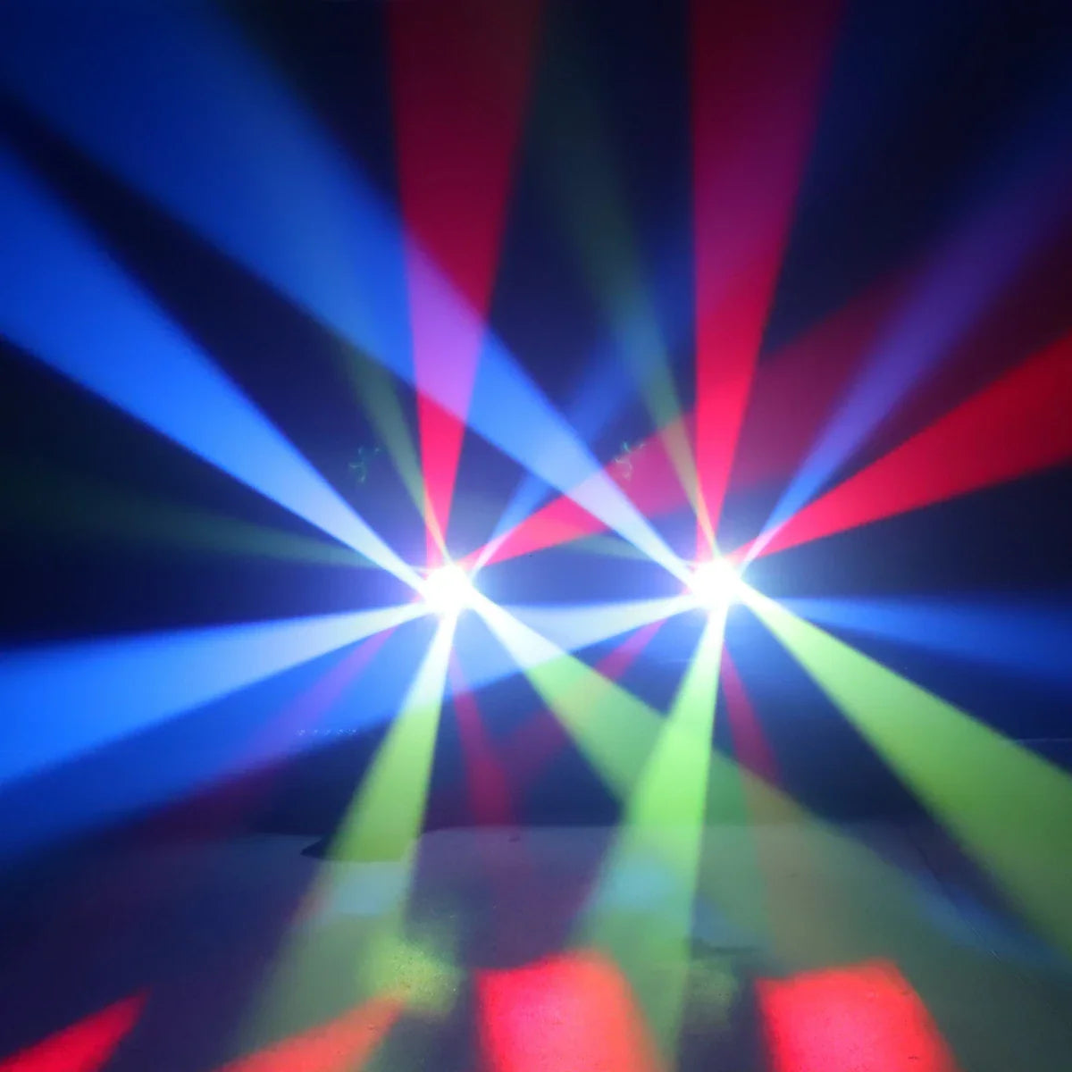 Colorful light beams projecting in a dark stage environment