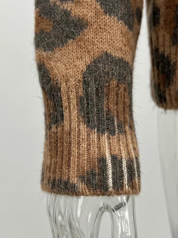 Ribbed knit sleeve cuff of a leopard print cardigan on a transparent mannequin arm