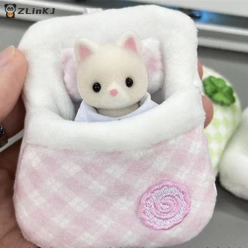 Miniature plush sleeping bag with a pink gingham pattern and flower detail for dolls