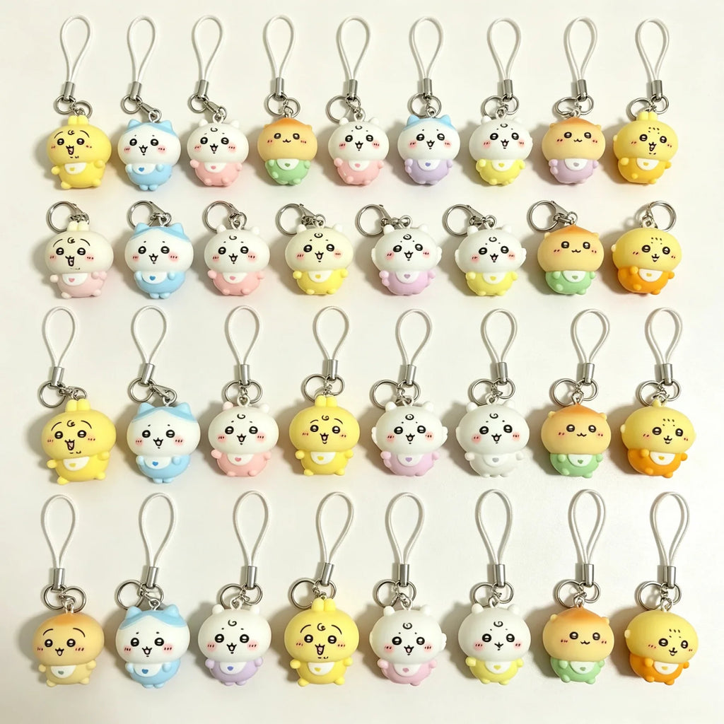 A collection of colorful resin character charms for phones and bags, featuring various animal designs with lanyards.