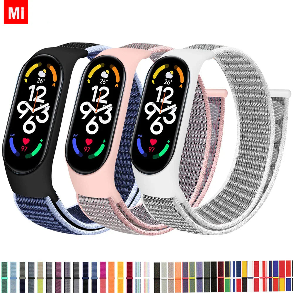 Collection of various nylon replacement watch bands for smart fitness trackers in different solid and rainbow colors
