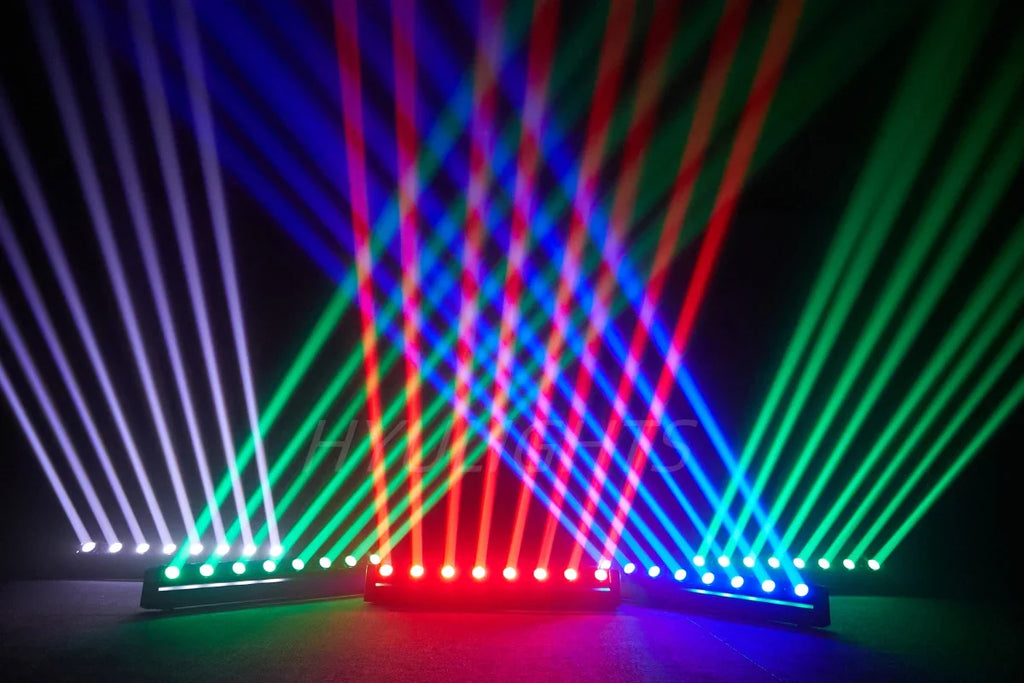 Three LED bar beam lights creating multicolored light beams in a dark environment