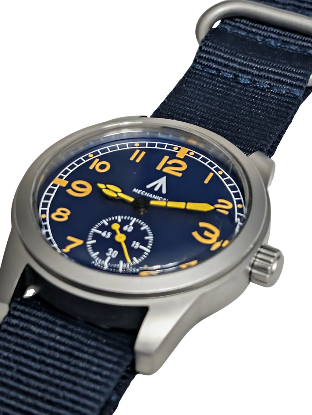 Angle view of blue dial field watch with mechanical movement and black fabric watch band