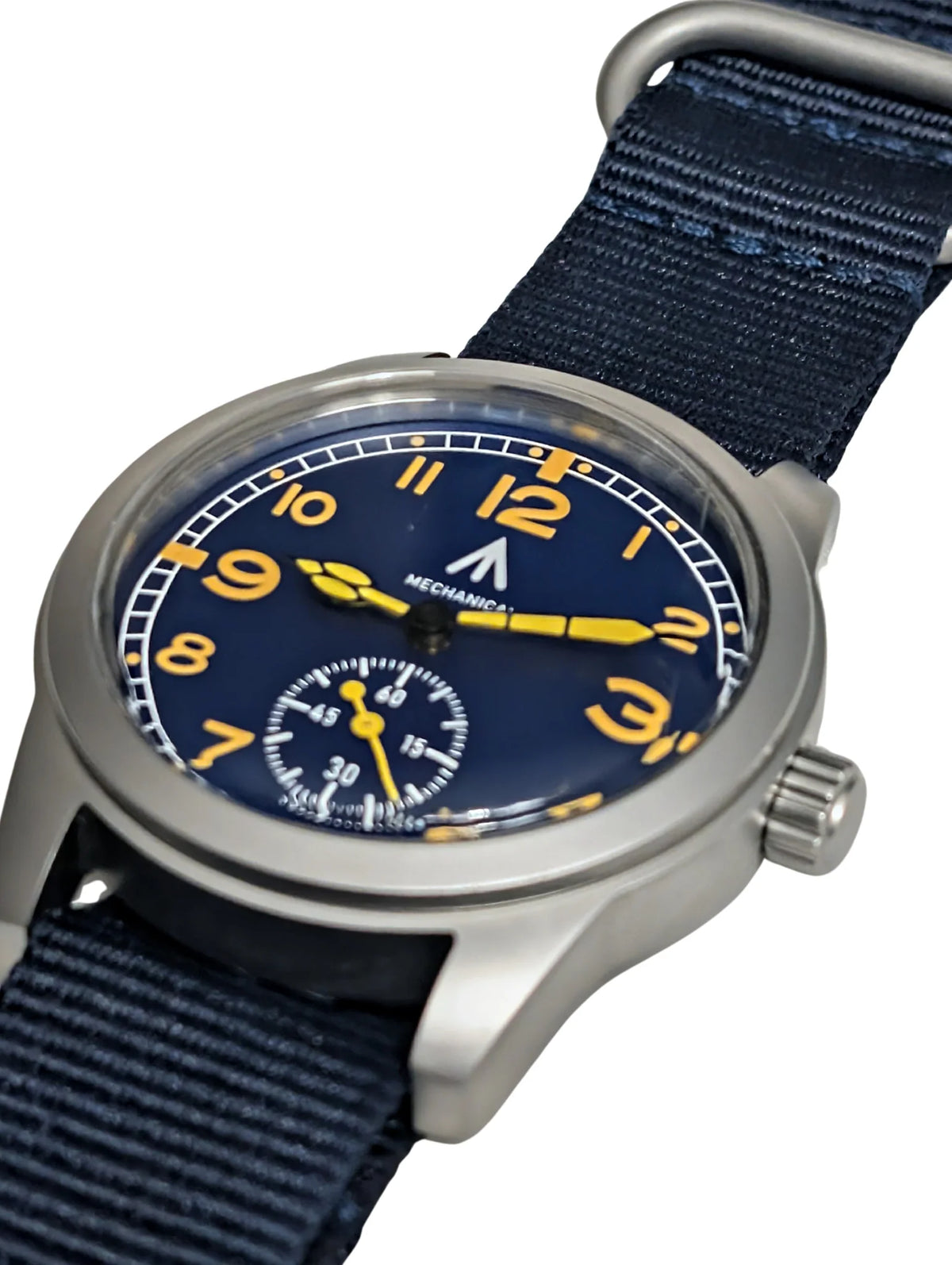 Angle view of blue dial field watch with mechanical movement and black fabric watch band