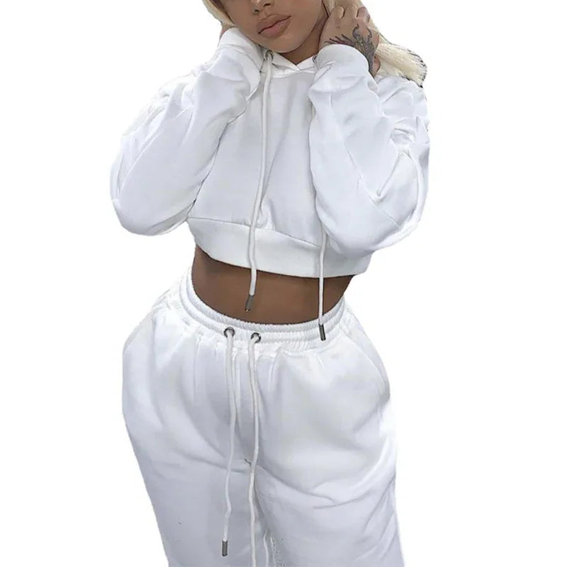White long-sleeve crop hoodie and matching sweatpants set on a white background