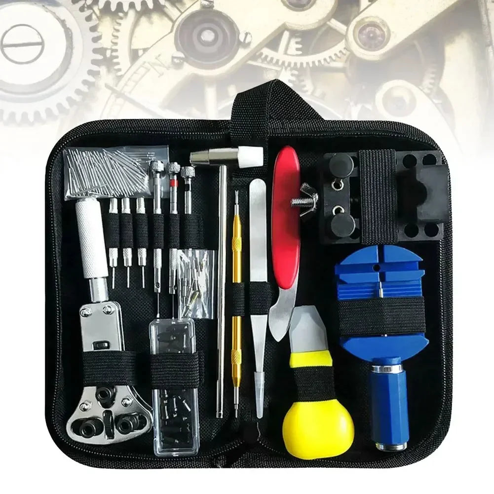 A watch repair toolkit containing various screwdrivers, a hammer, pliers, and other specialized maintenance tools in a case