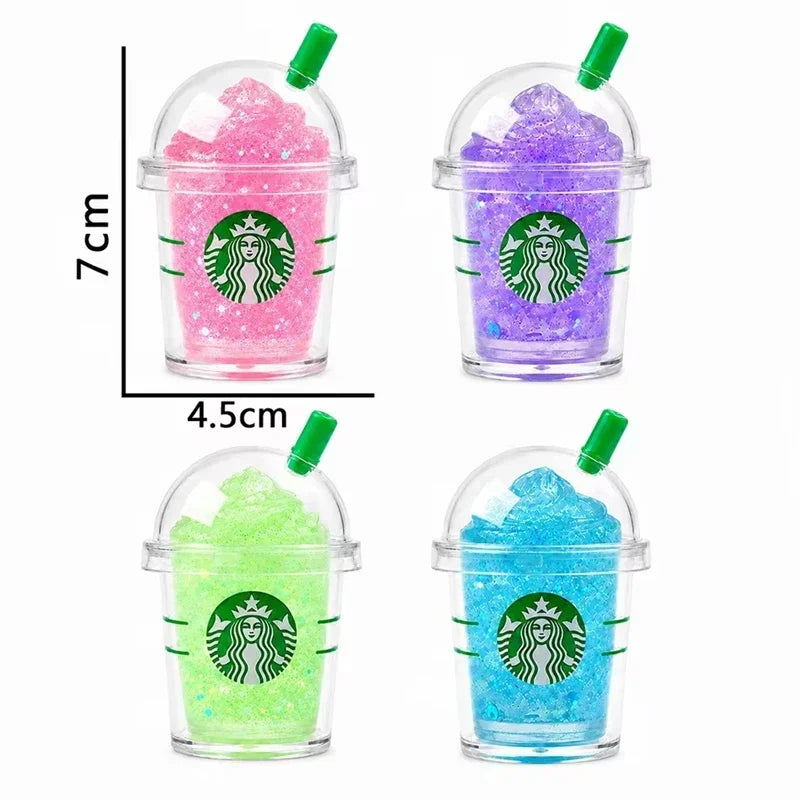Four glittery coffee cup shaped squishy toys with height and width dimension labels.